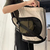 Breathable mesh front carrier for cats, designed to be worn on the chest